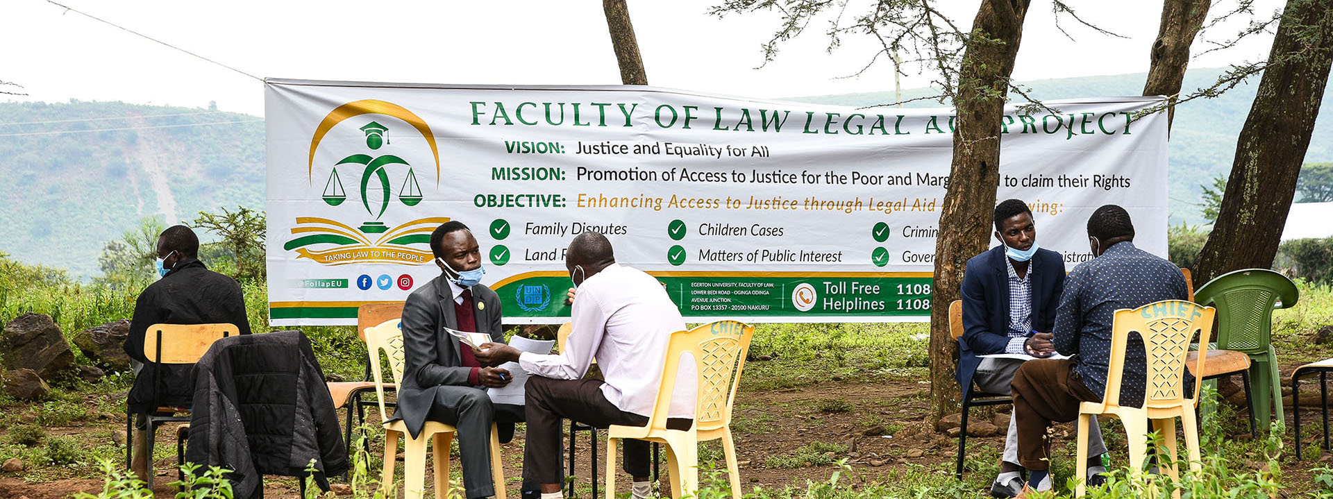 Dean Faculty of Law at Egerton University Dr Ruth Aura (centre) and a senior Administrative officer at the Nakuru County Commissioner’s office Mary Mwangi (right) hands over a certificate to a participant at the end of the Legal Aid training in Nakuru on August 2, 2020