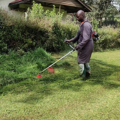 Mr Wycliffe Odhiambo Using The Brush Cutter At Main Campus Njoro On 13 July 2021