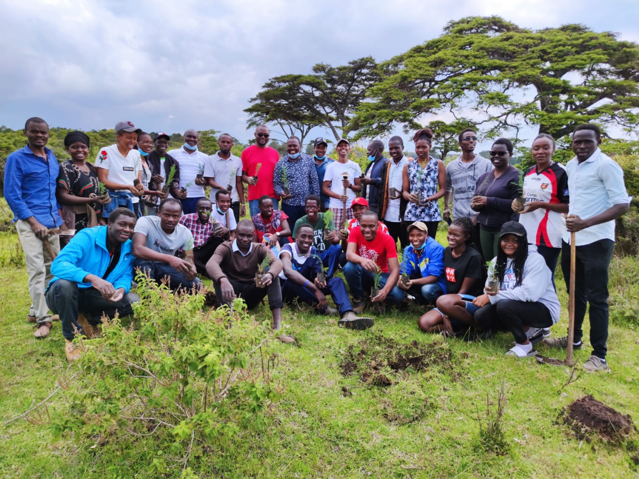 Egerton University staff and students participate in a tree planting event at Main Campus in Njoro